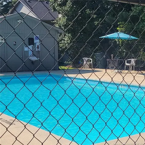 a view of a park with large trees