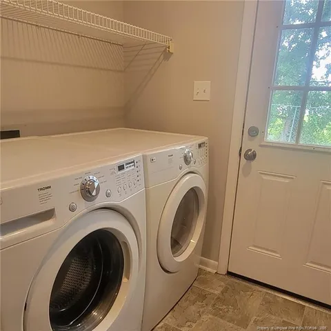 a kitchen with a refrigerator and a microwave