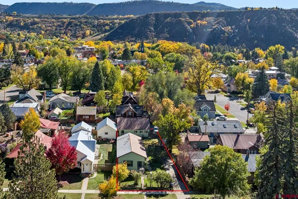 an aerial view of residential houses with outdoor space