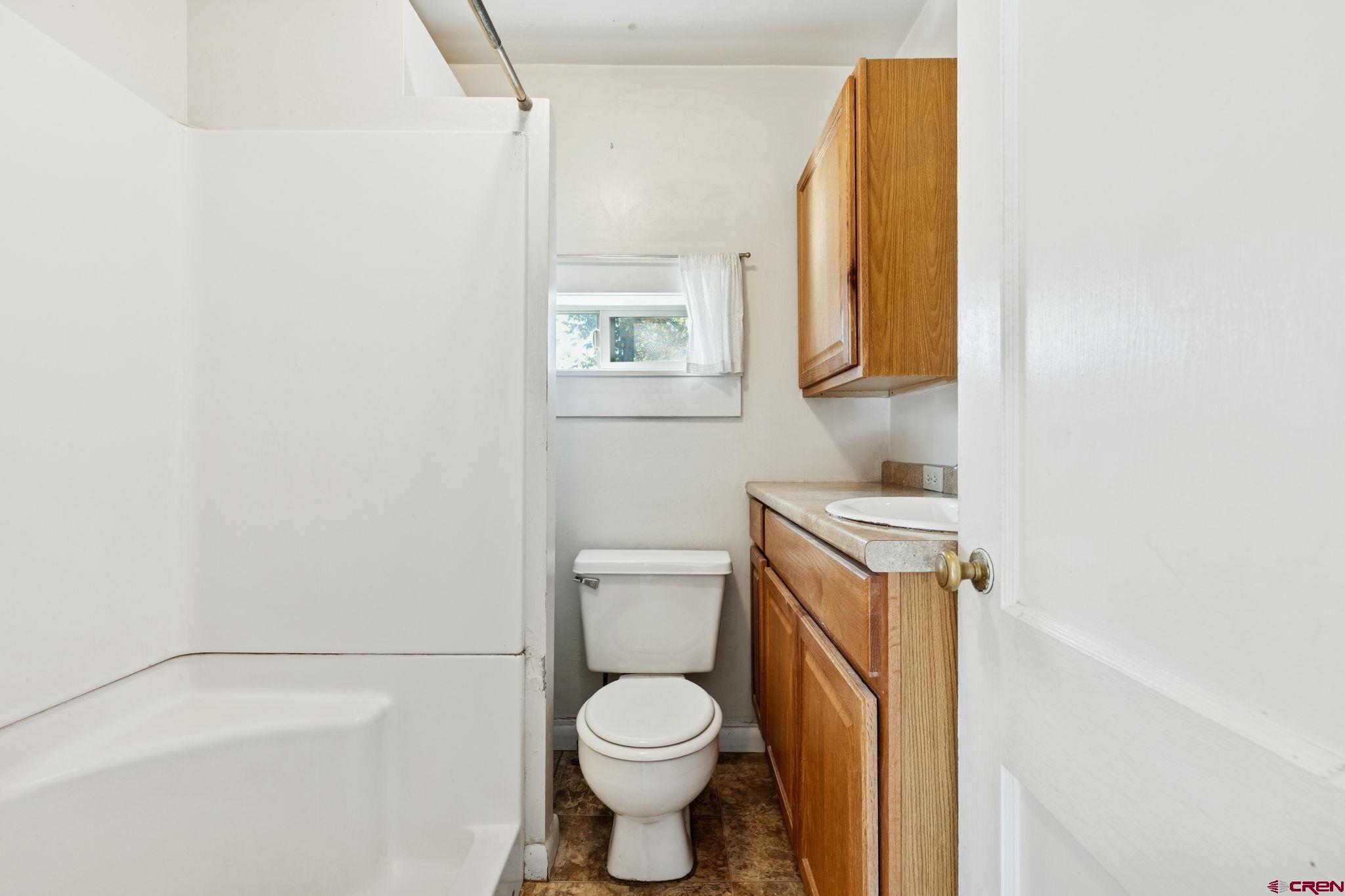 1840 West 3rd Avenue Durango, CO 81301 - Photo 20 of 33 a white toilet sitting next to a shower