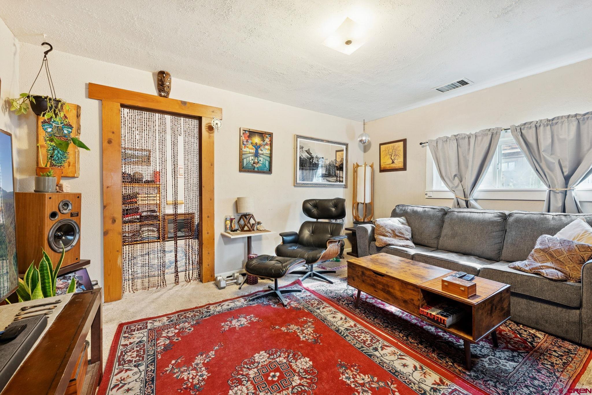 1840 West 3rd Avenue Durango, CO 81301 - Photo 27 of 32 a living room with furniture a rug and a window