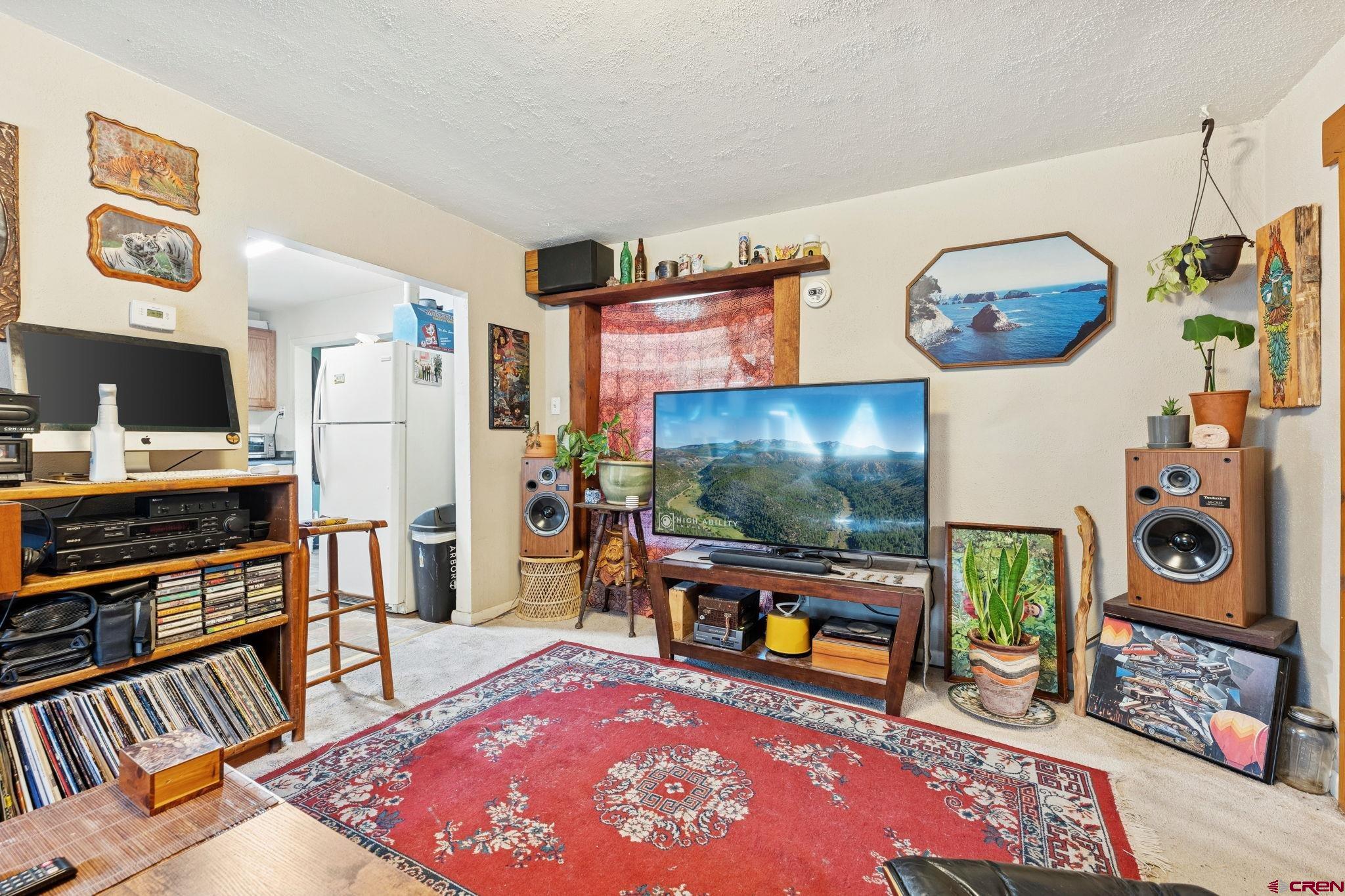 1840 West 3rd Avenue Durango, CO 81301 - Photo 28 of 32 a living room with furniture and a flat screen tv