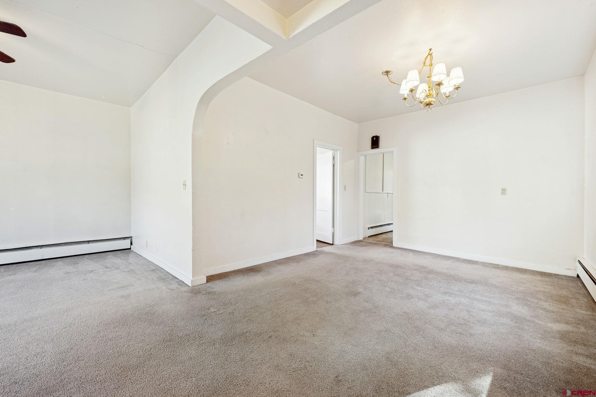 1840 West 3rd Avenue Durango, CO 81301 - Photo 7 of 32 a view of an empty room with chandelier
