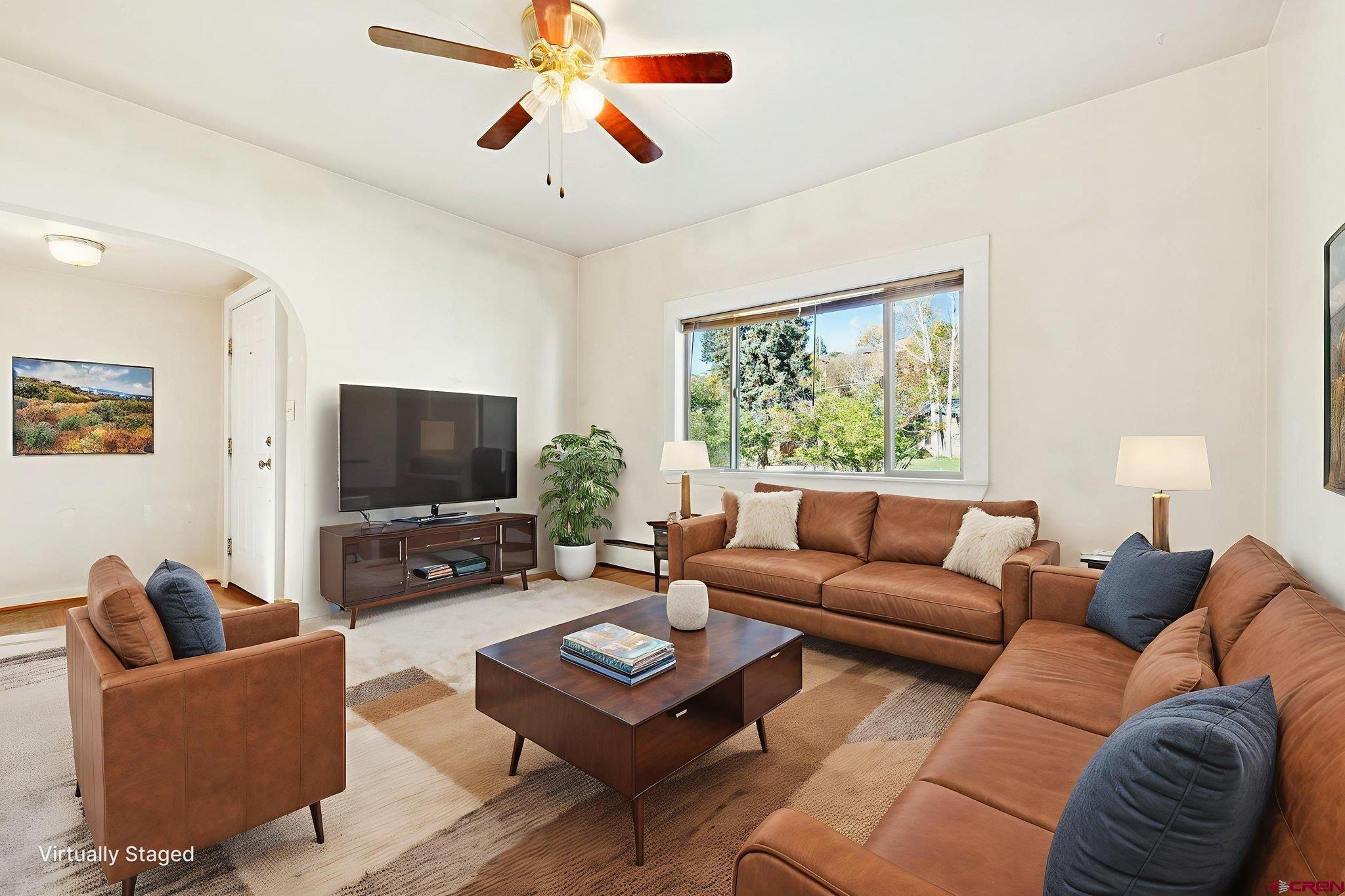 1840 West 3rd Avenue Durango, CO 81301 - Photo 8 of 32 a living room with furniture and a flat screen tv