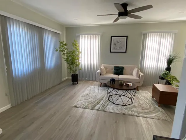 a living room with furniture and a window