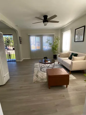 a living room with furniture and a window