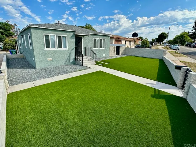 a front view of house with yard and seating area