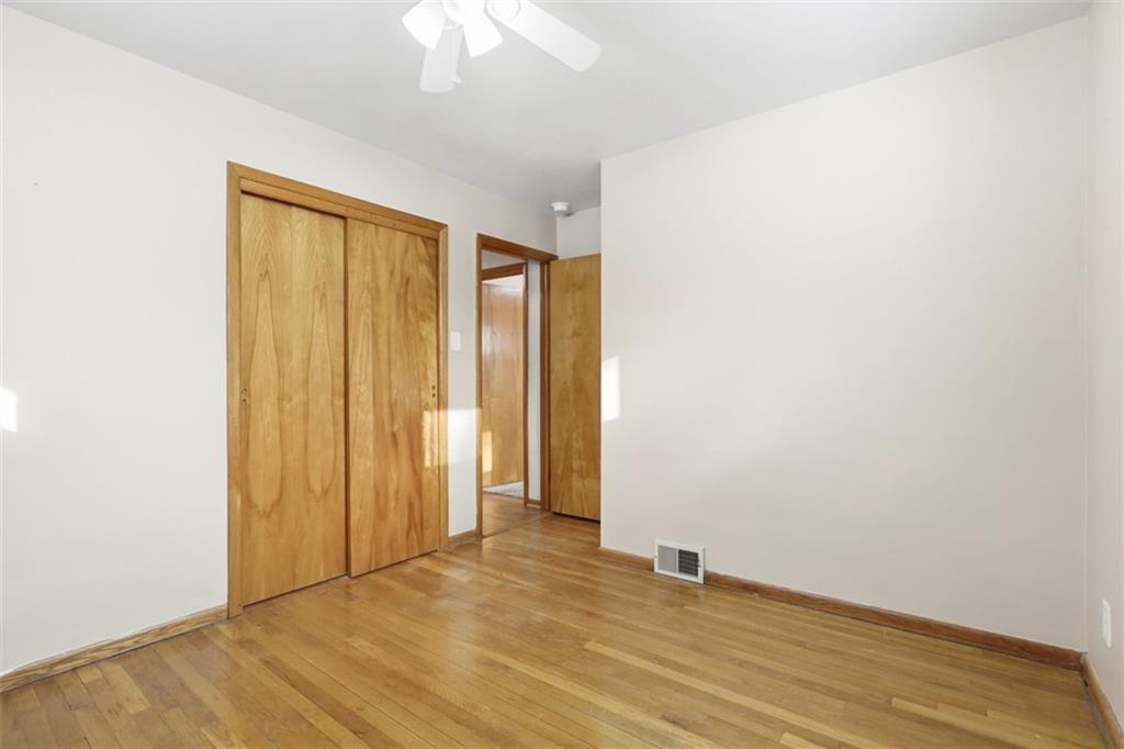 431 Colonial Drive Monroeville, PA 15146 - Photo 14 of 28 an empty room with wooden floor and closet area