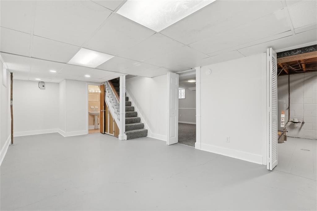 431 Colonial Drive Monroeville, PA 15146 - Photo 21 of 28 an empty room with wooden floor and stairs