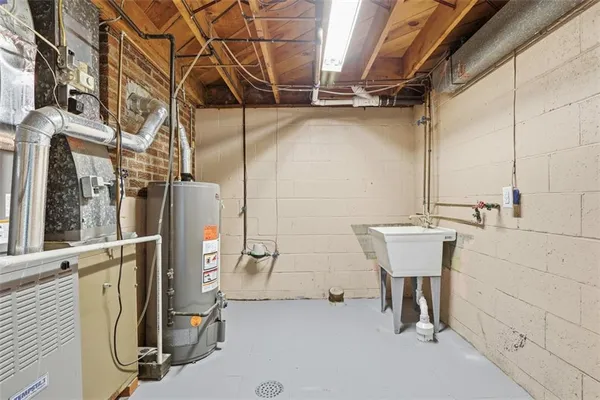 a view of a bathroom with a sink and mirror