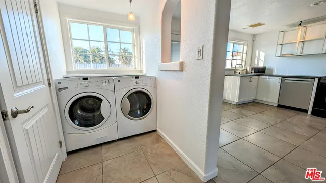 a view of a kitchen with washer and dryer