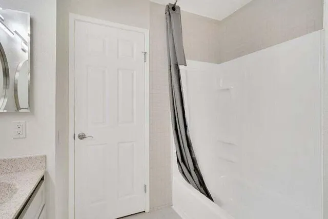 a view of a hallway with stairs