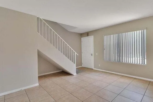 a view of entryway and hall with a window