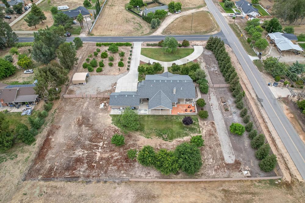 17465 Monreal Road Madera, CA 93636 - Photo 48 of 59 an aerial view of a house with garden space and street view
