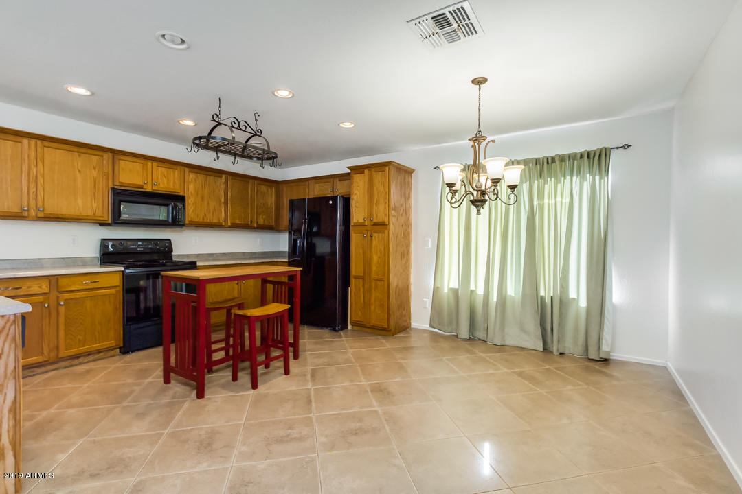 1986 West Tanner Ranch Road Queen Creek, AZ 85144 - Photo 11 of 32 a view of kitchen with furniture and appliances
