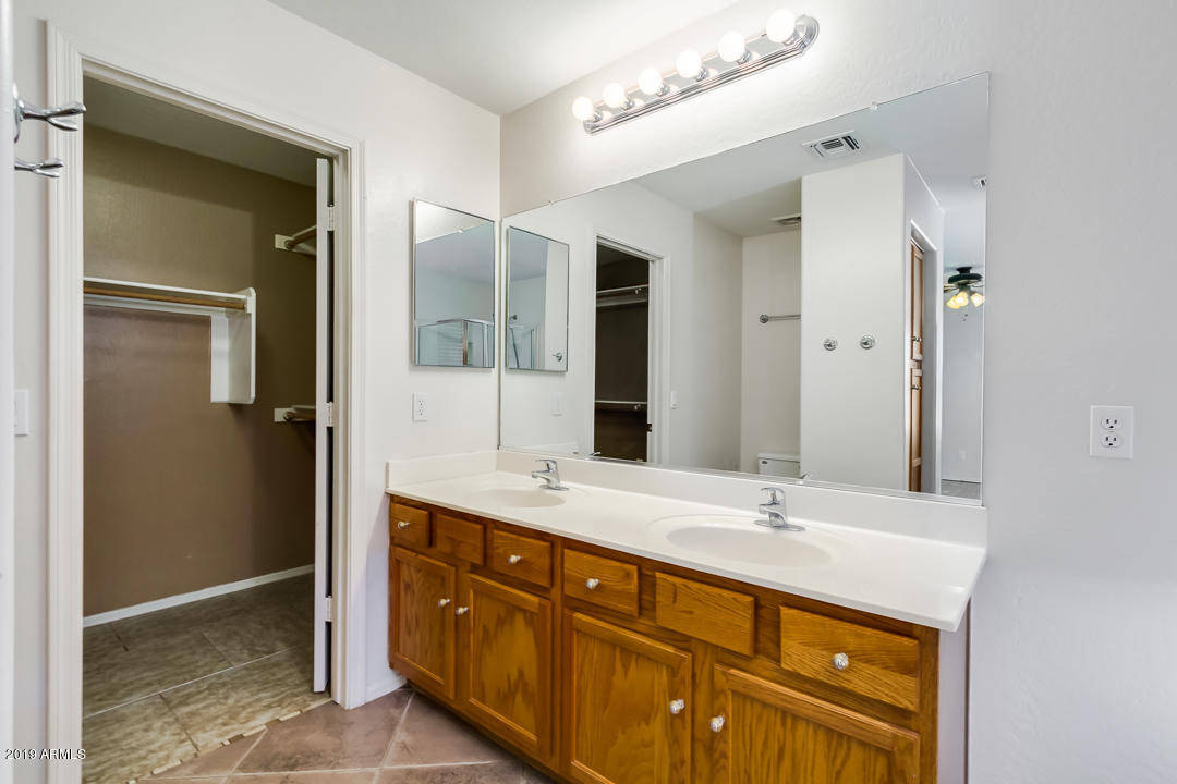 1986 West Tanner Ranch Road Queen Creek, AZ 85144 - Photo 22 of 32 a bathroom with a sink double vanity and a mirror