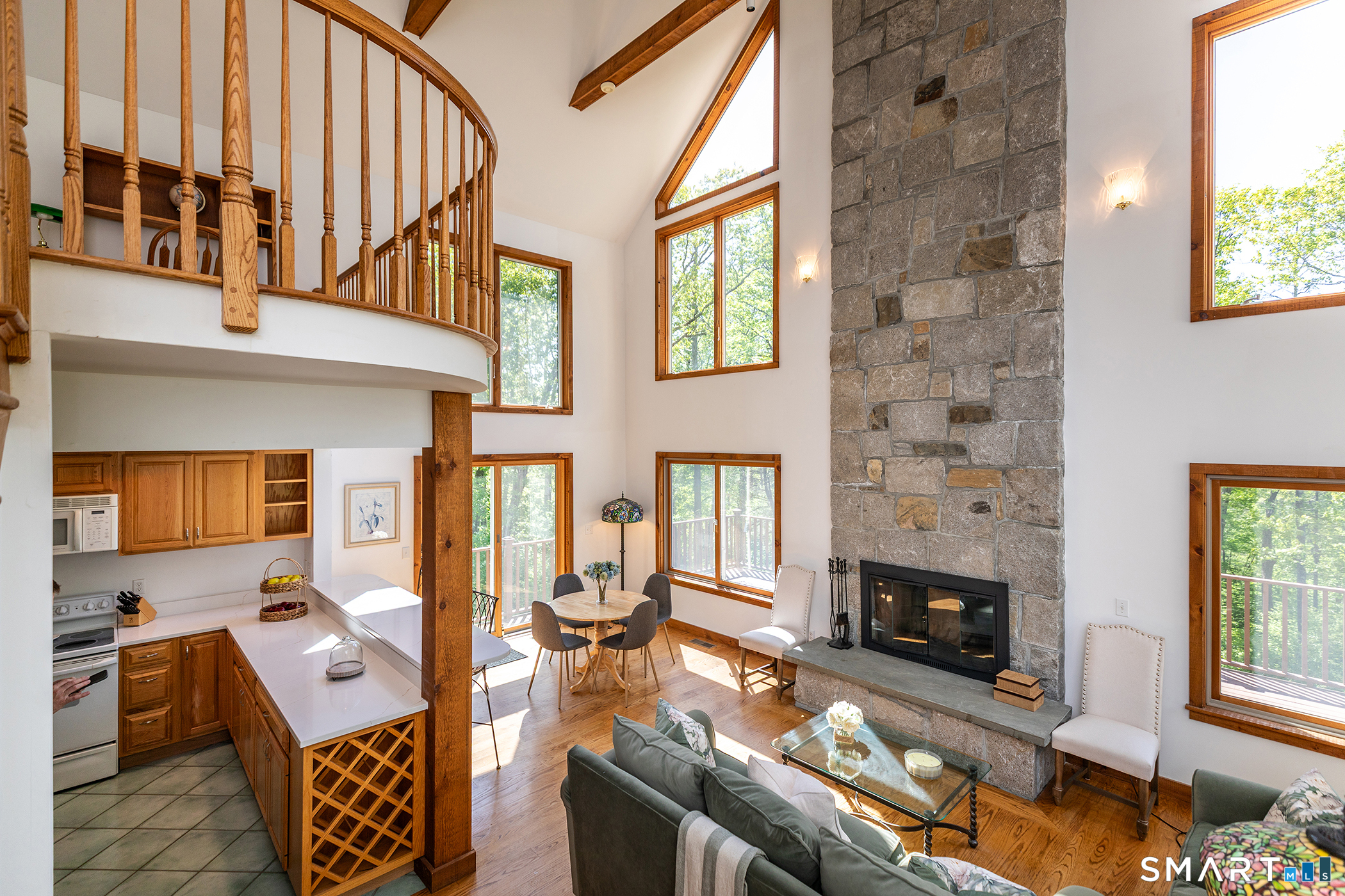 3 Old Forest Road Sherman, CT 06784 - Photo 8 of 38 a living room with furniture floor to ceiling window and a fireplace