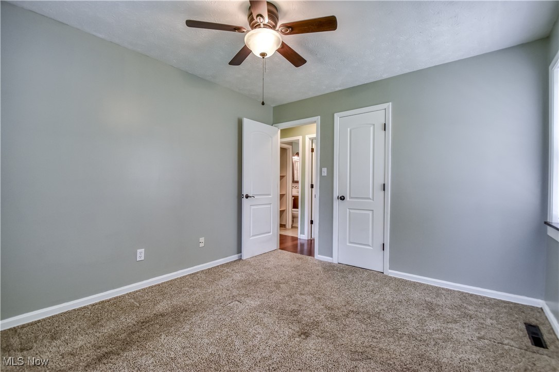 1919 Sandgate Road Madison, OH 44057 - Photo 20 of 28 Unfurnished bedroom featuring carpet flooring and a ceiling fan