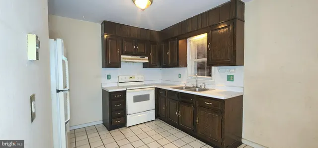 a spacious bathroom with a double vanity sink mirror and