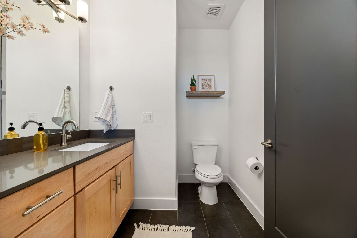 3700 Clawson Road, Unit 503 Austin, TX 78704 - Photo 20 of 39 a bathroom with a granite countertop toilet and sink