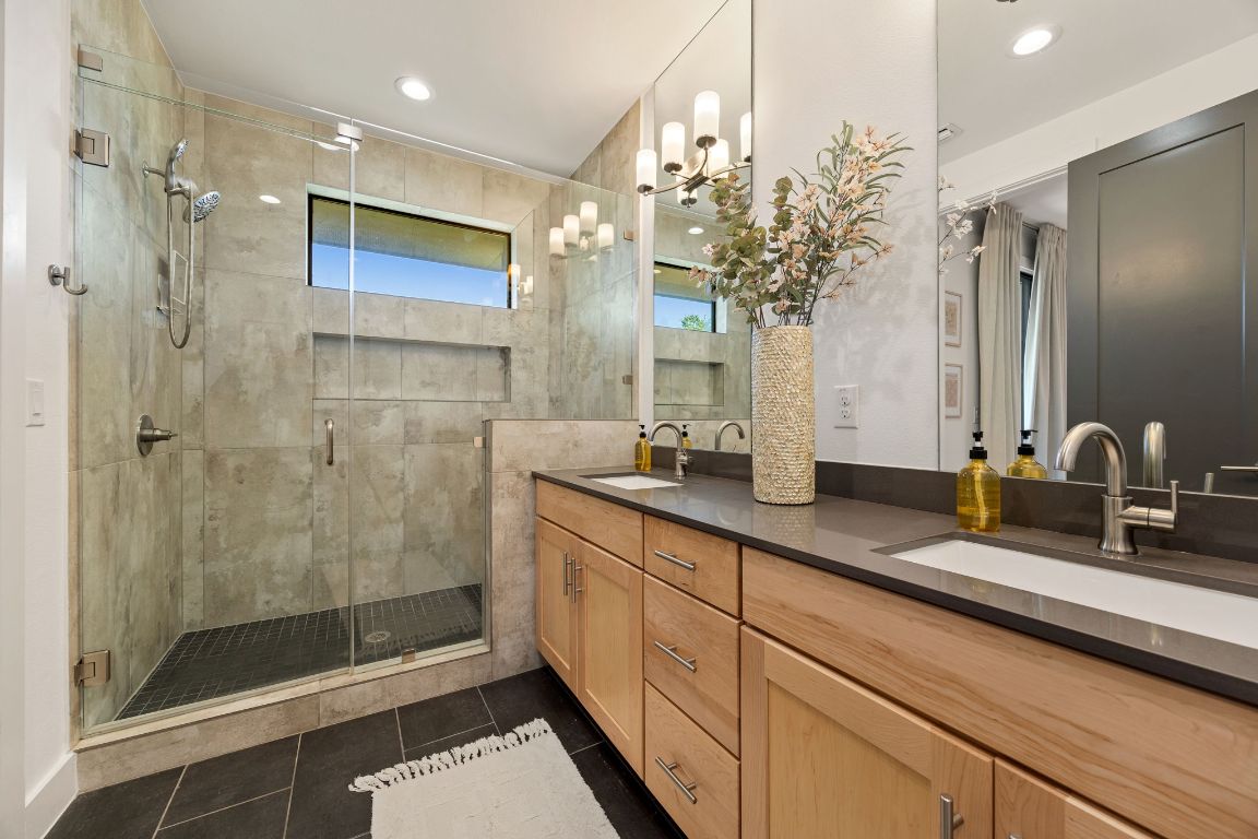3700 Clawson Road, Unit 503 Austin, TX 78704 - Photo 5 of 39 a bathroom with a double vanity sink mirror and shower