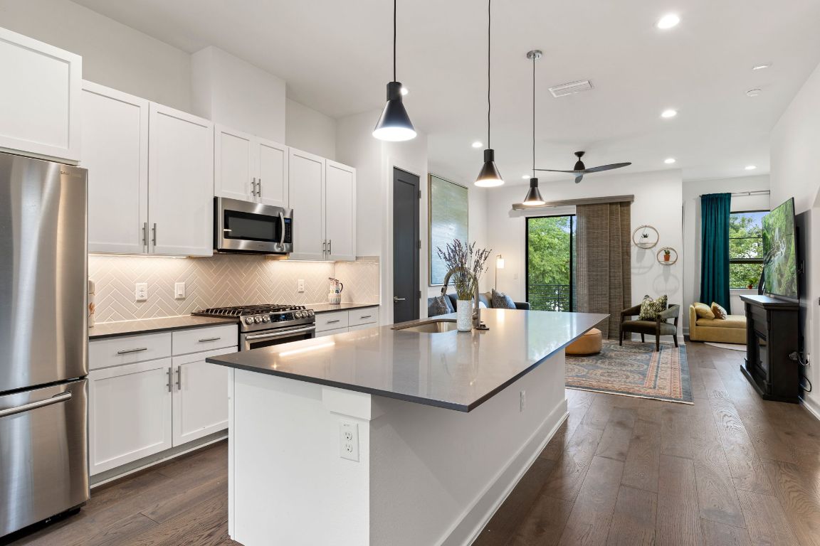 3700 Clawson Road, Unit 503 Austin, TX 78704 - Photo 8 of 39 a large kitchen with kitchen island a large island in the center
