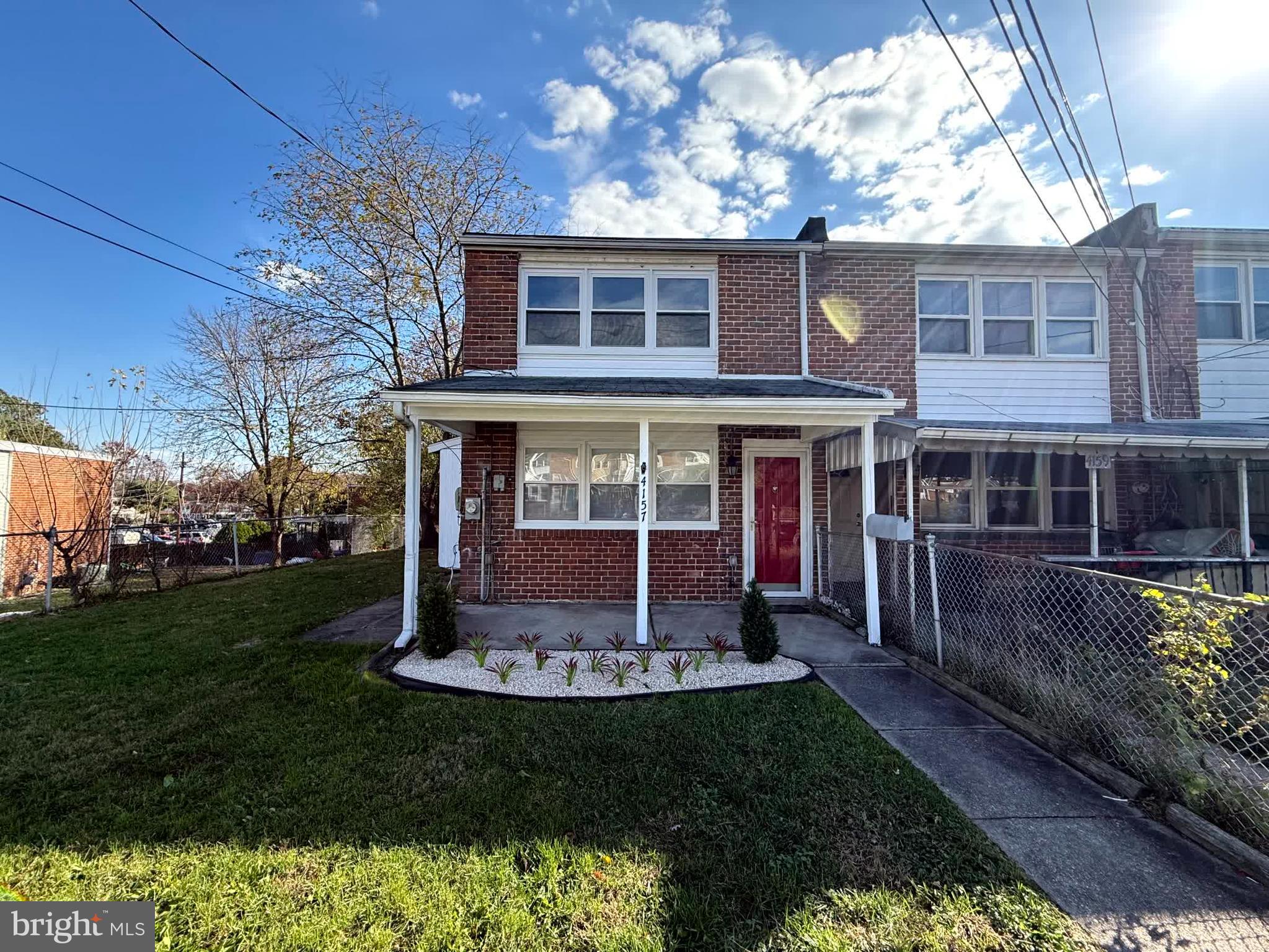 a view of house with yard and entertaining space