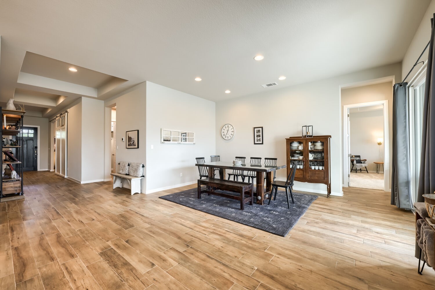 621 Rancho Sienna Loop Georgetown, TX 78628 - Photo 9 of 28 Elegant hardwood flooring extends throughout this versatile living and dining area, accented by tray ceilings.