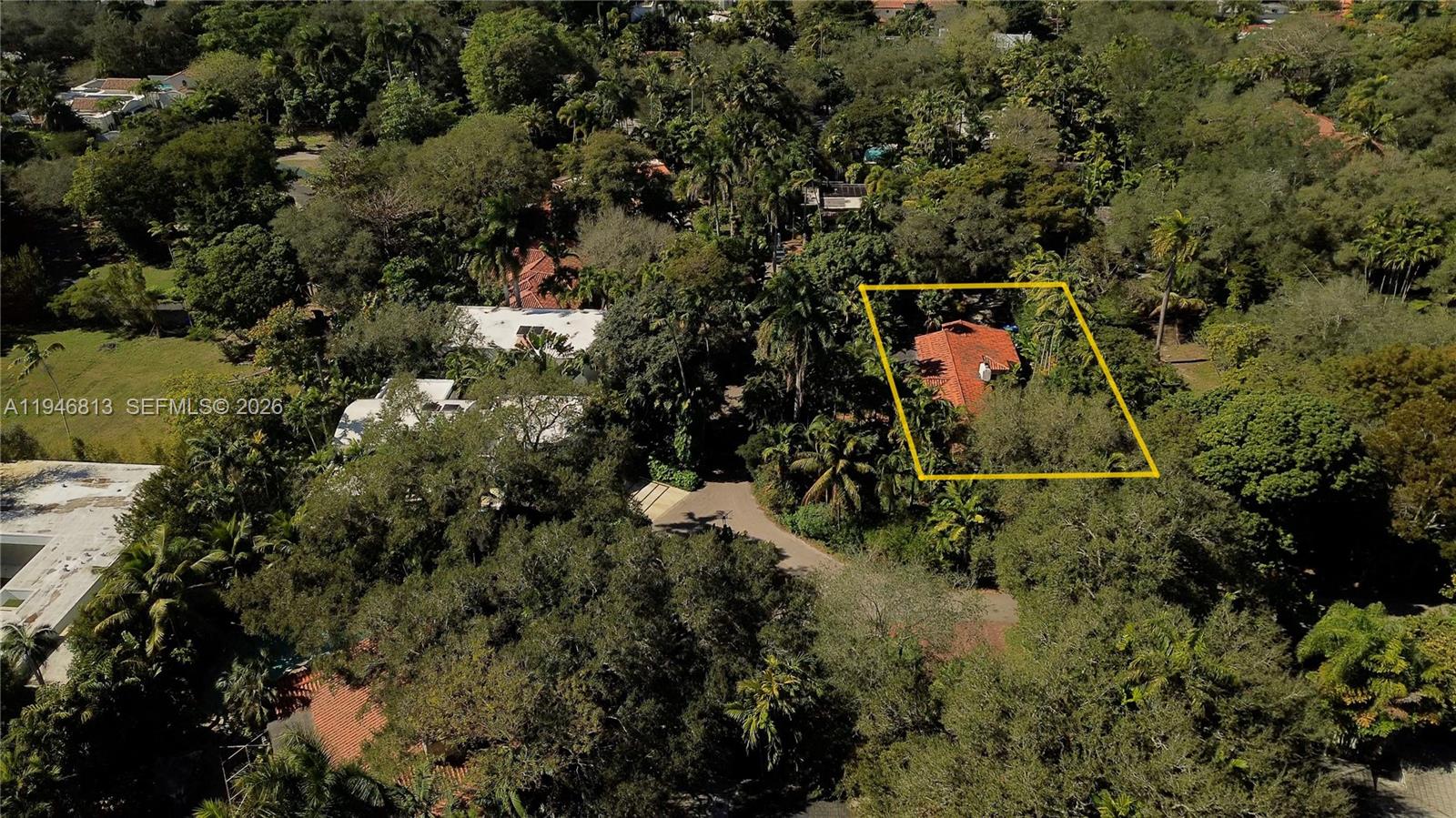 3835 Utopia Court Miami, FL 33133 - Photo 36 of 38 view of outdoor space with lots of trees