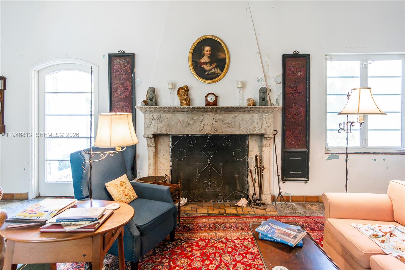 3835 Utopia Court Miami, FL 33133 - Photo 10 of 38 a living room with furniture and a fireplace