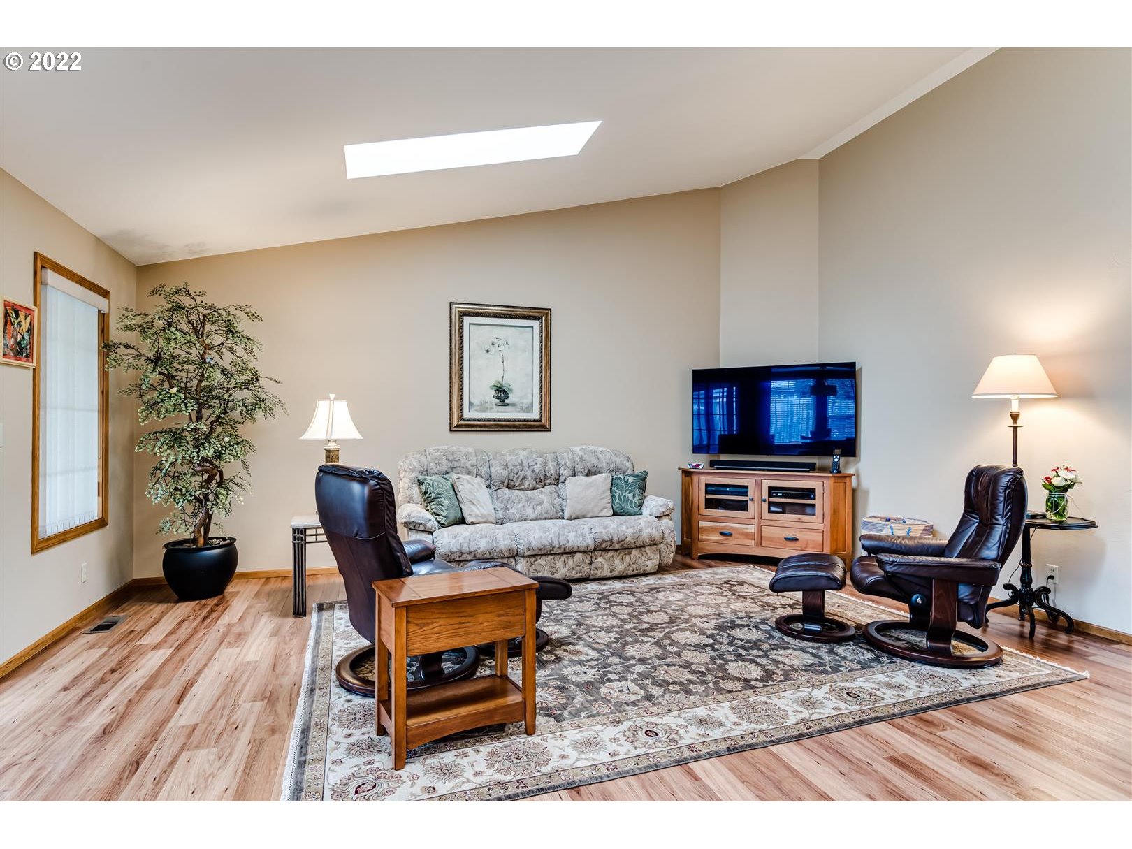 834 Raintree Way Springfield, OR 97477 - Photo 11 of 28 a living room with furniture and a flat screen tv