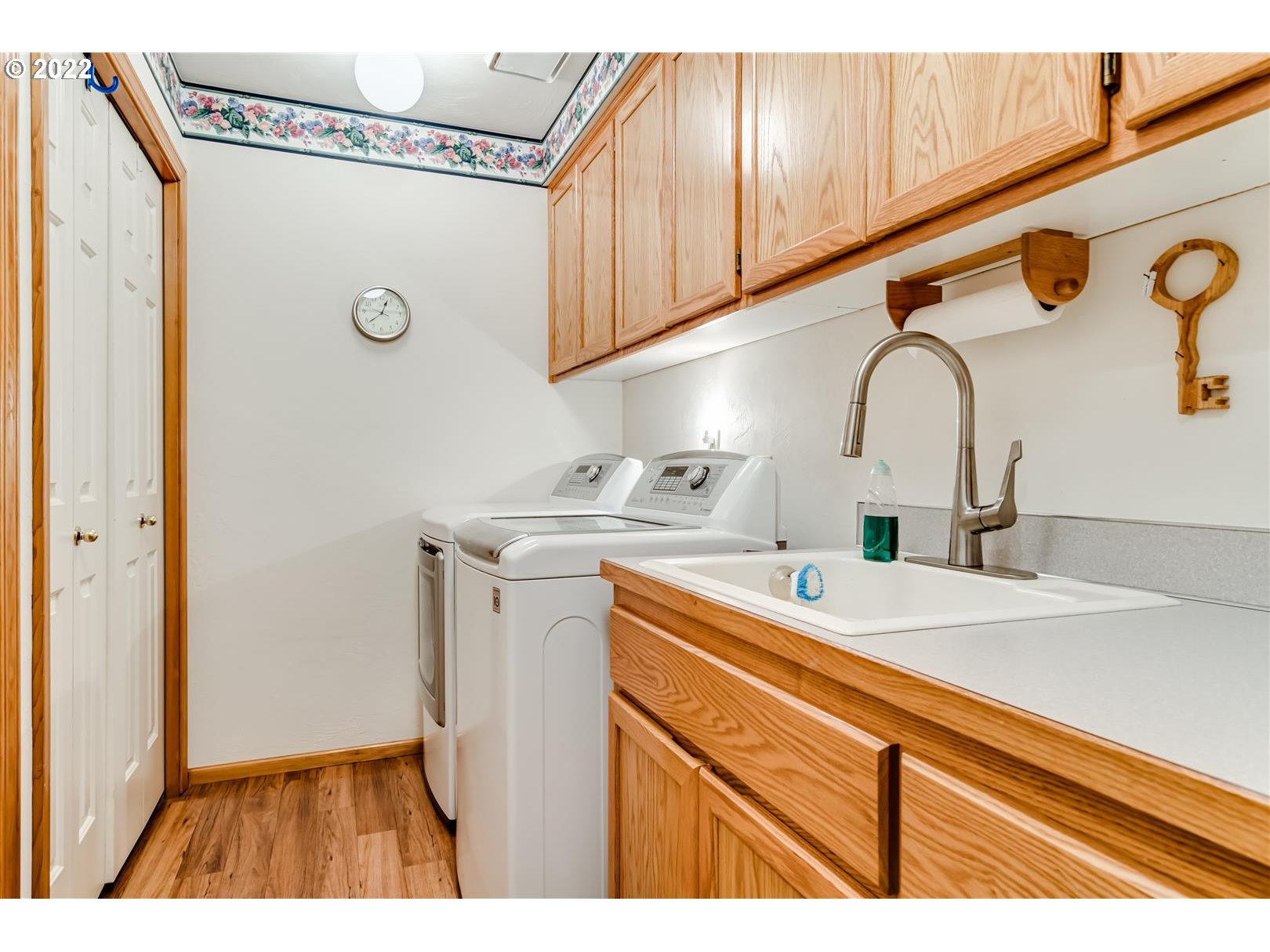 834 Raintree Way Springfield, OR 97477 - Photo 18 of 28 a kitchen with a sink and a refrigerator