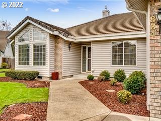 834 Raintree Way Springfield, OR 97477 - Photo 2 of 28 a front view of a house with a yard