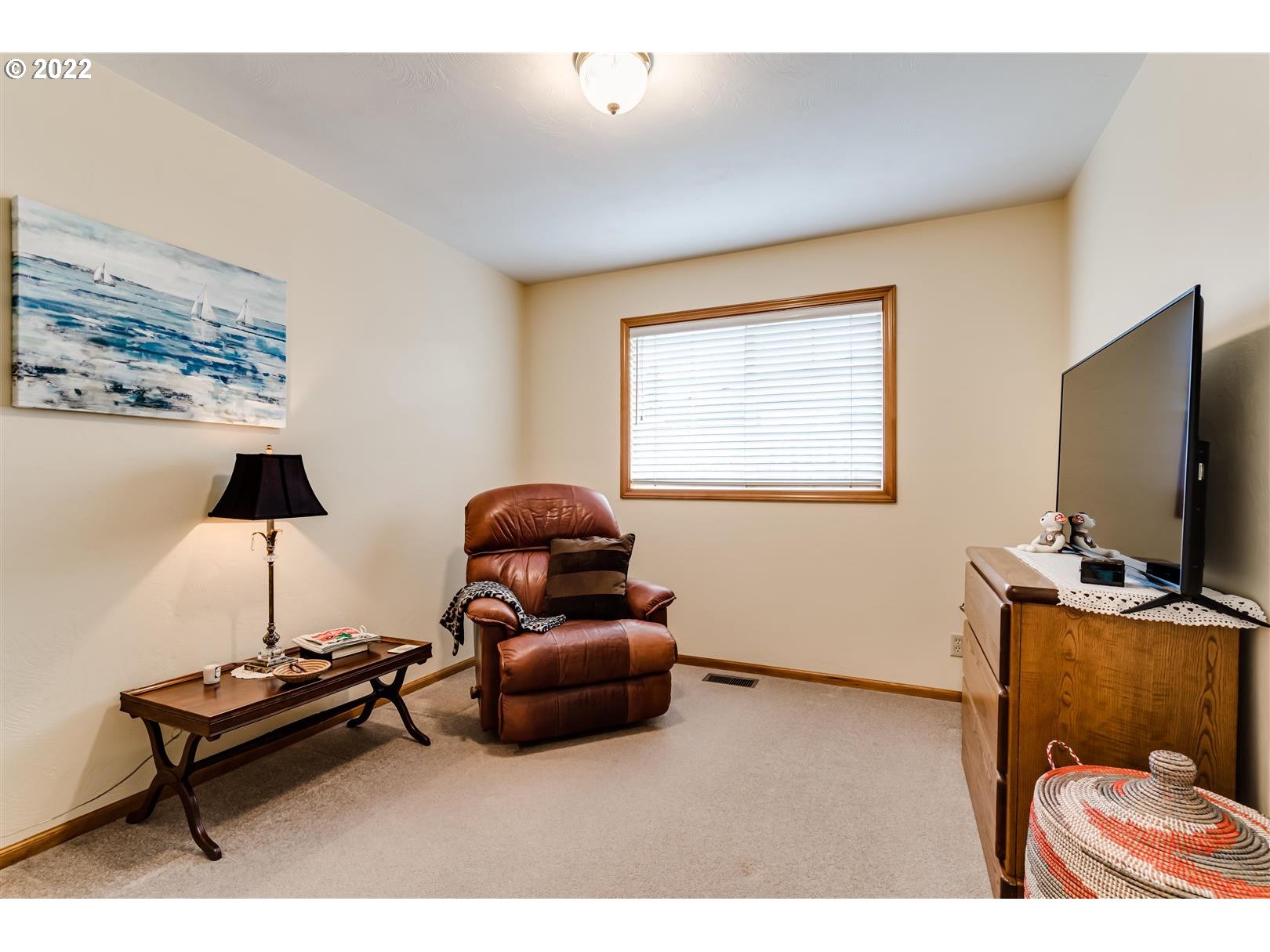 834 Raintree Way Springfield, OR 97477 - Photo 24 of 28 a living room with furniture and a flat screen tv