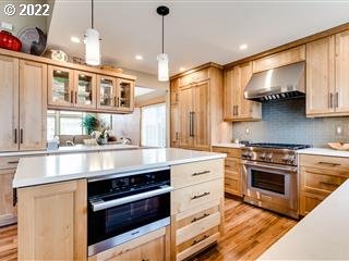 834 Raintree Way Springfield, OR 97477 - Photo 3 of 28 a kitchen with stainless steel appliances granite countertop a stove and a sink