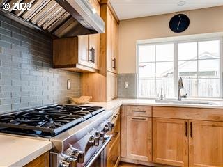 834 Raintree Way Springfield, OR 97477 - Photo 5 of 28 a kitchen with granite countertop a stove and a sink