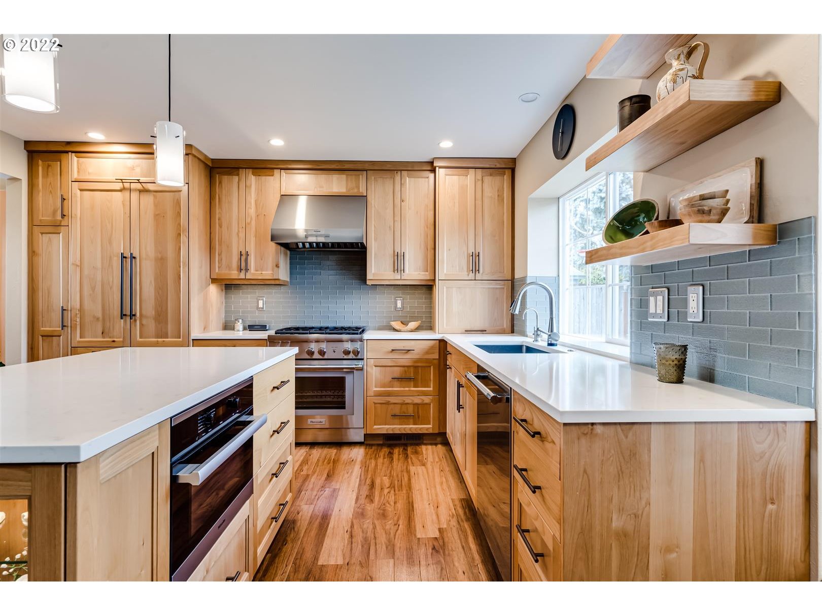 834 Raintree Way Springfield, OR 97477 - Photo 6 of 28 a kitchen with a stove a sink and a refrigerator