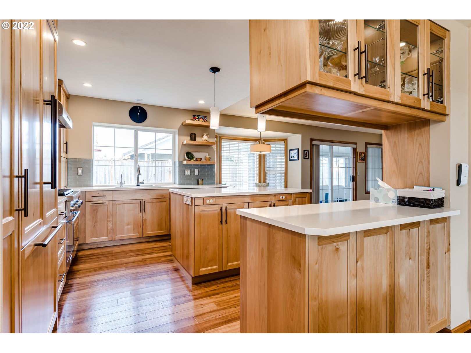 834 Raintree Way Springfield, OR 97477 - Photo 8 of 28 a kitchen view of a kitchen island wooden floor and stainless steel appliances