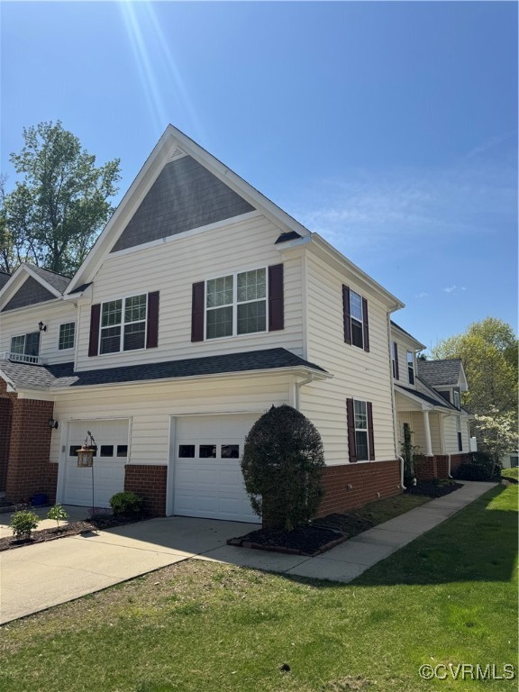 View of front of property with a garage, driveway,