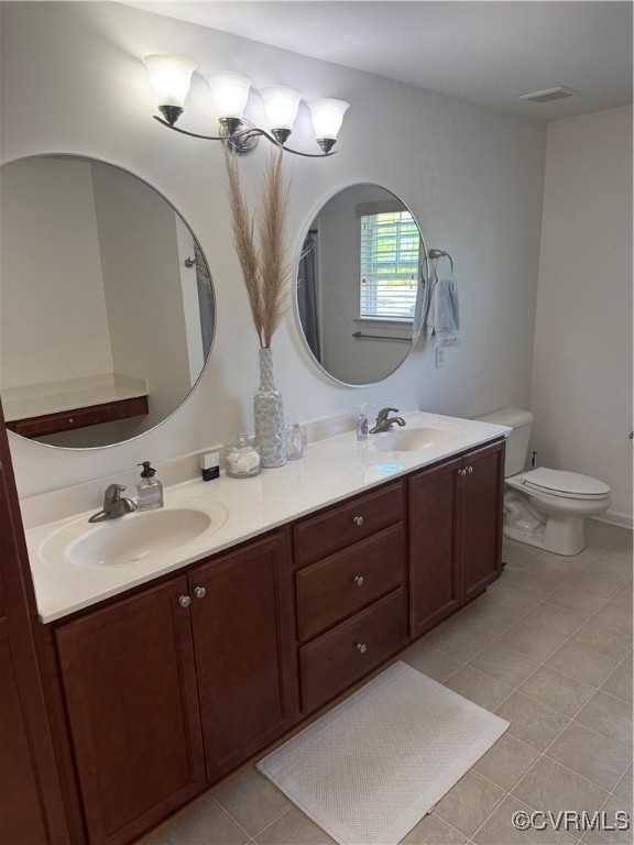 1802 Rustads Circle Williamsburg, VA 23188 - Photo 19 of 26 Bathroom featuring double vanity, tile patterned f