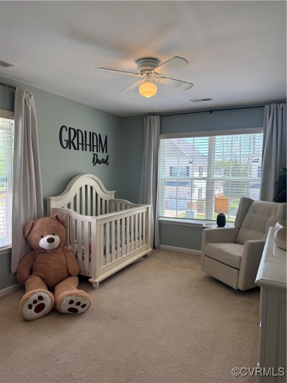 1802 Rustads Circle Williamsburg, VA 23188 - Photo 21 of 26 Bedroom with a crib, ceiling fan, carpet floors, b