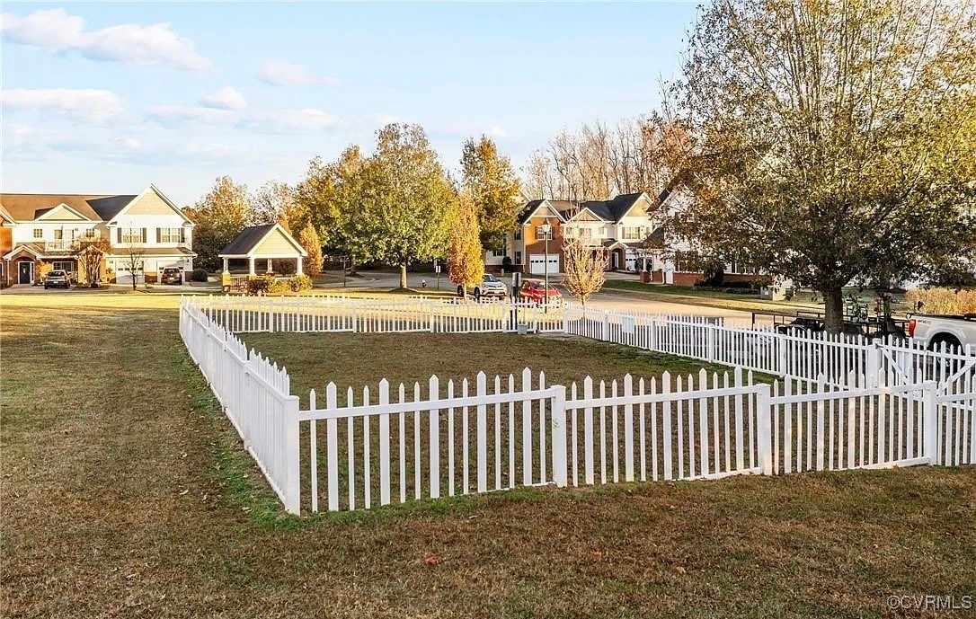 1802 Rustads Circle Williamsburg, VA 23188 - Photo 24 of 26 View of yard featuring a residential view and fenc