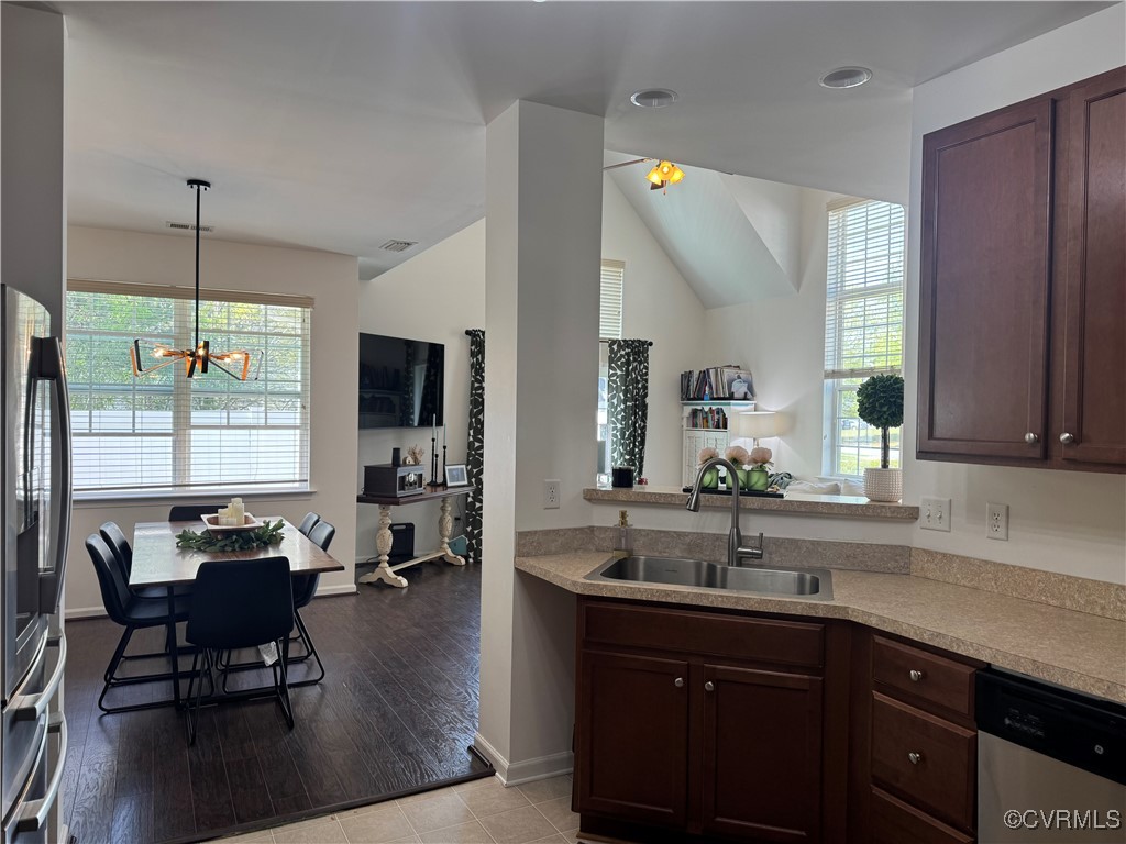 1802 Rustads Circle Williamsburg, VA 23188 - Photo 9 of 26 Kitchen featuring dark brown cabinetry, stainless