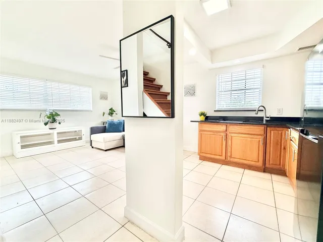 a kitchen with stainless steel appliances a sink and a counter top space