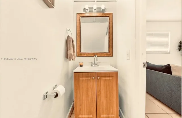 a bathroom with a sink a mirror and a bathtub