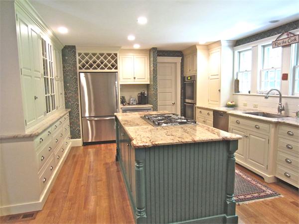 96 Abbott Road Wellesley, MA 02481 - Photo 11 of 14 a kitchen with kitchen island a sink stove and refrigerator