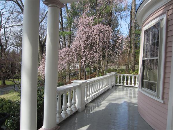 96 Abbott Road Wellesley, MA 02481 - Photo 2 of 14 a view of a balcony with wooden floor and fence