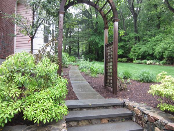 96 Abbott Road Wellesley, MA 02481 - Photo 4 of 14 a view of a garden with large trees