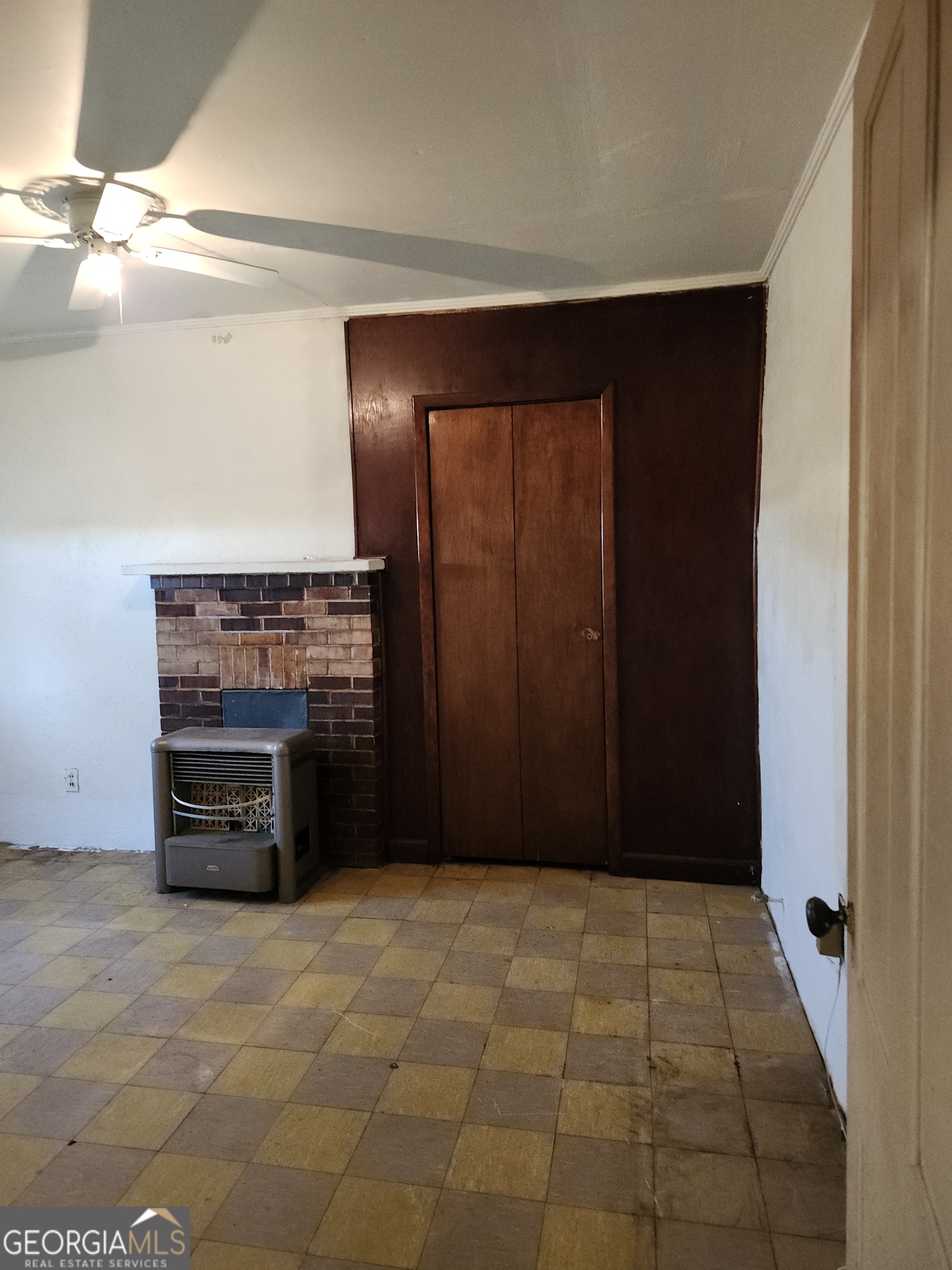 1121 Carroll Street Macon, GA 31206 - Photo 5 of 10 a view of an empty room with a fireplace