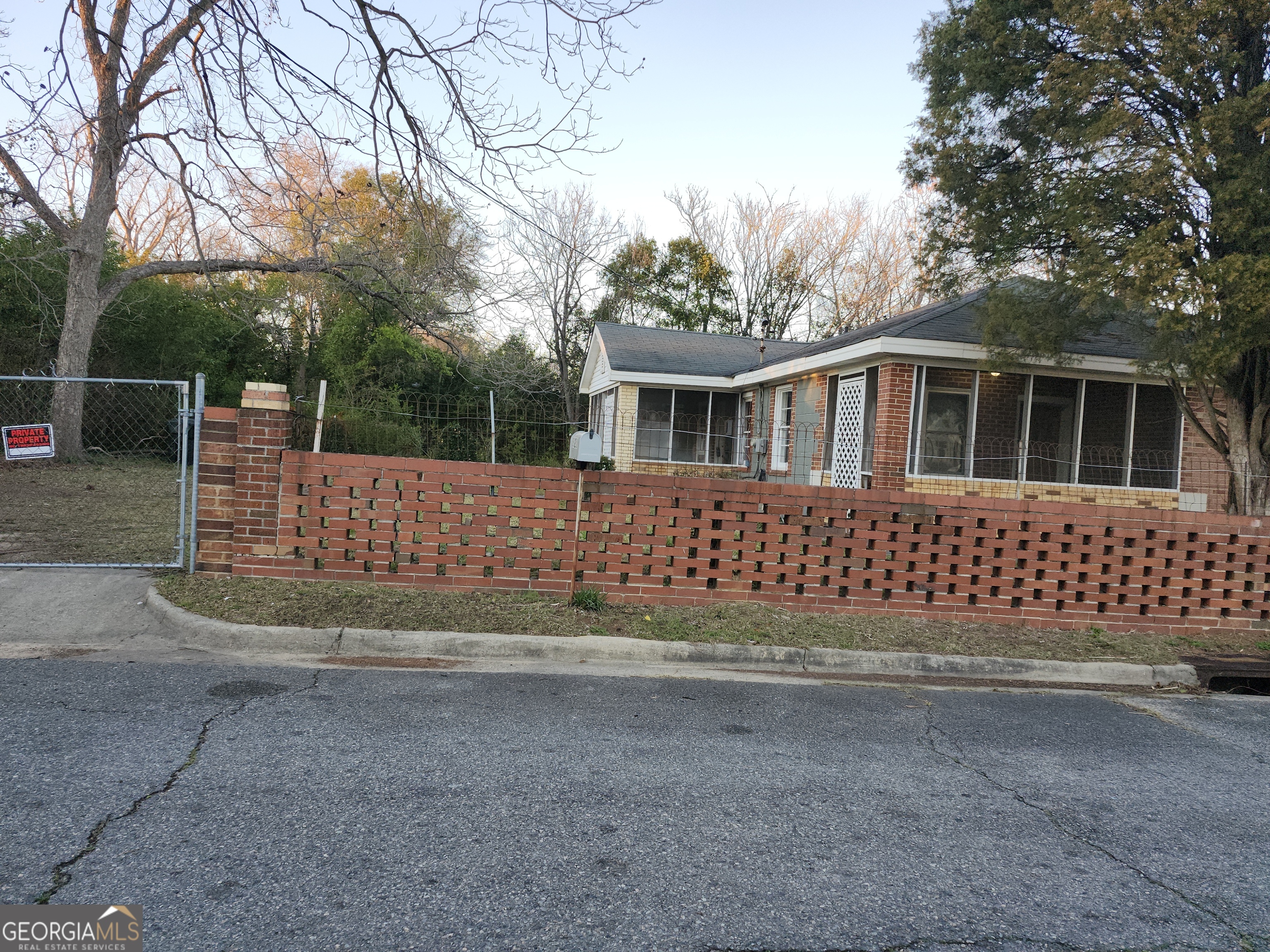 1121 Carroll Street Macon, GA 31206 - Photo 9 of 10 a front view of a house with a yard